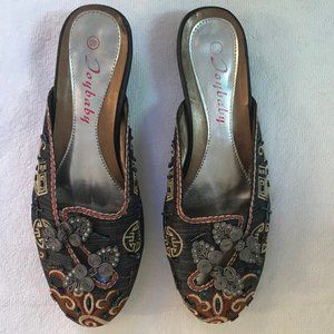 Unique slip on shoes covered in fabric and beads